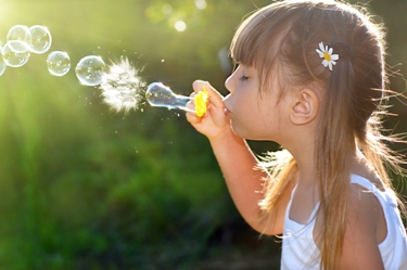 Girl blowing bubbles